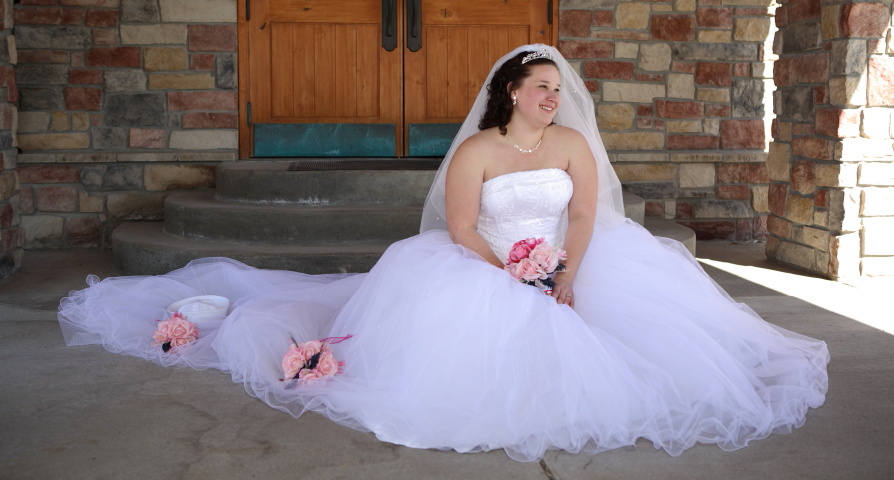 Bride sitting on the ground